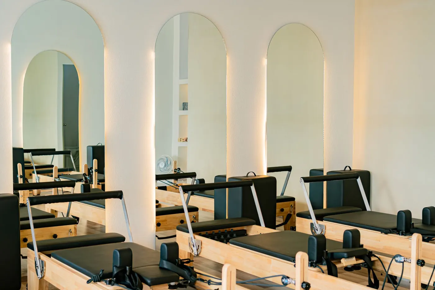 Bright, calm Pilates studio with reformer machines