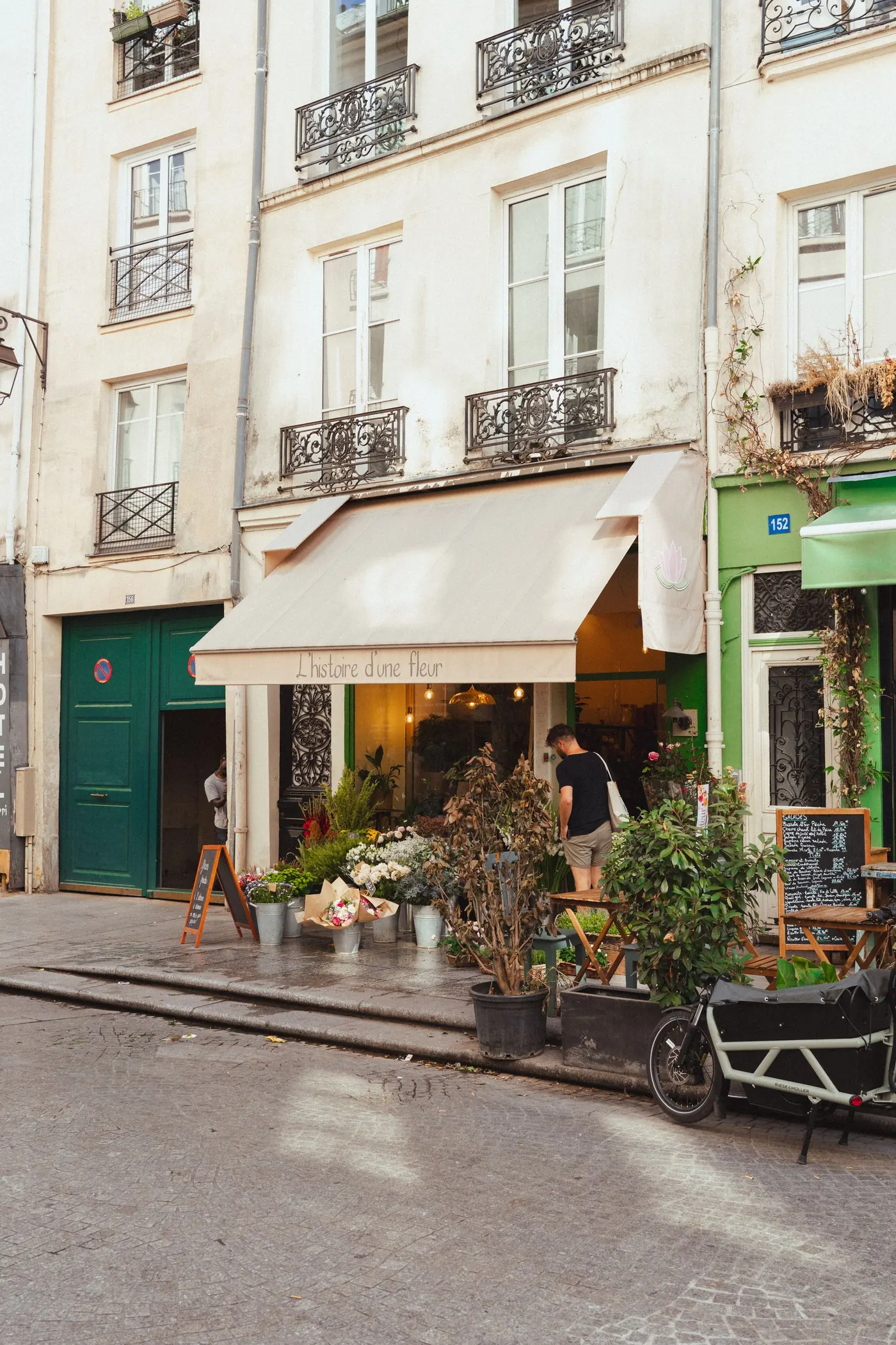 Warm neighborhood café and flower shop on a Paris street