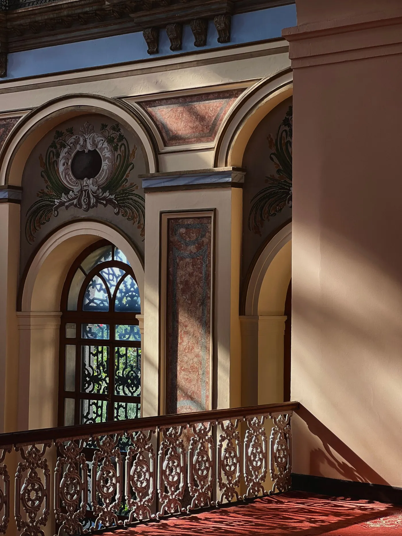 Sunlit arched interior with warm architectural details